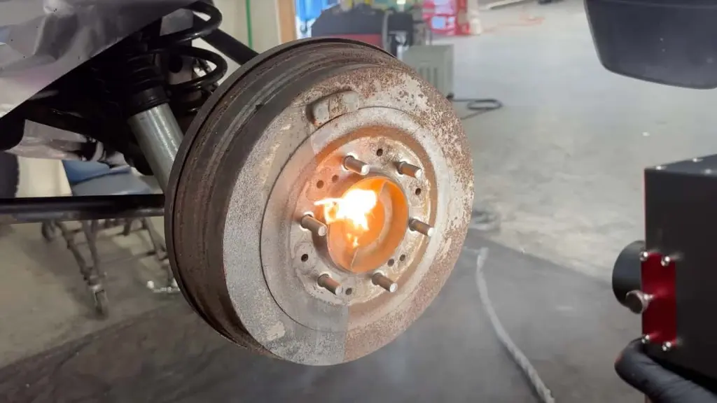 surface-rust-being-removed-from-a-brake-drum-with-laser-cleaning-machine.webp
